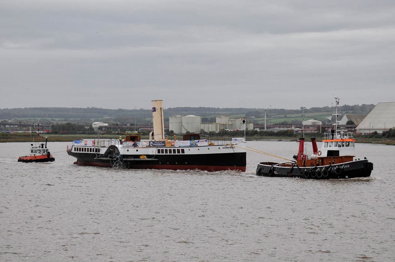 The paddle steamer Medway Queen is towed out of Bristol Docks on her way back to the Medway