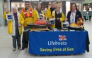 The team from the RNLI Egham and Virginia Water branch at their collection table in the Elmsleigh Centre, Staines. They raised more than £1,000 in a day