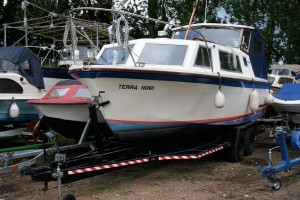 Terra Nova on her trailer measures 35-feet in length; add the length of the towing vehicle and getting her out of the tight turn at the access road will be an interesting experience